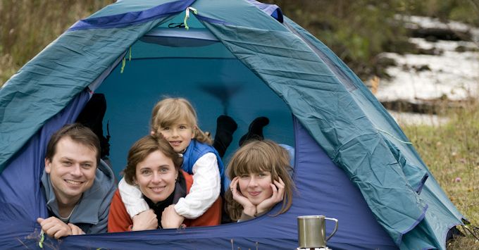 A young family camping in their tent